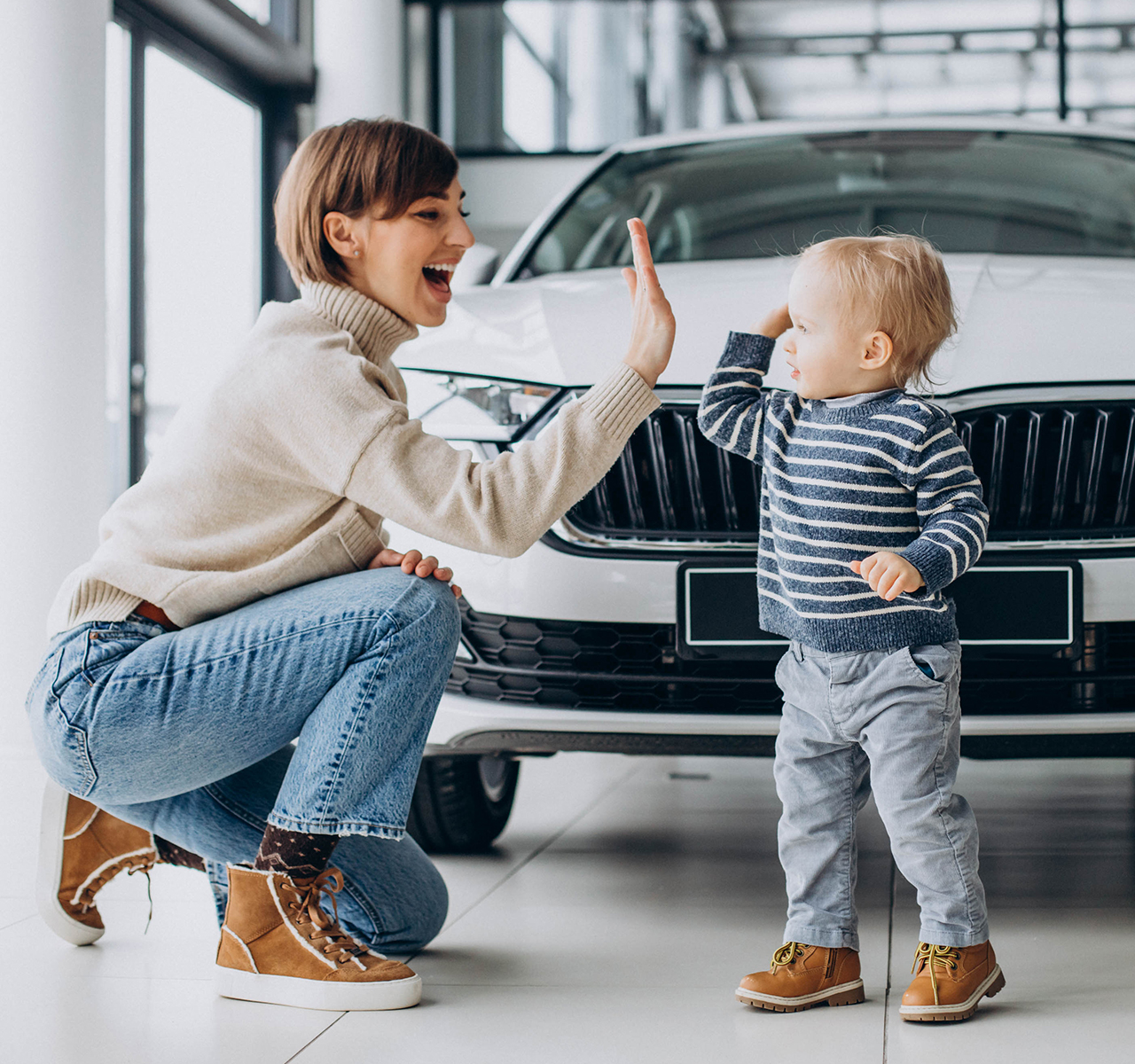 https://galanopouloscarservice.gr/wp-content/uploads/2022/08/woman-with-baby-son-choosing-car-car-salon.jpg